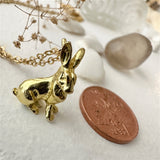 Basil Hare Charm Necklace in Raw Brass