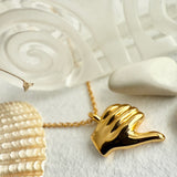 Odium Thumbs Down Charm Necklace in Gold